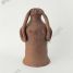 Phoenician votive terracotta statue of a woman pointing with her hands to her ailing head, 3rd Century BC