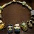 Punic glass paste necklace consisting of four bearded heads, 4th century BC, Olbia, Sardinia